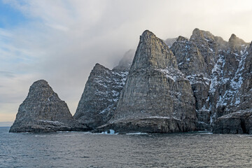 Dramatic Cliff Emerging from the Fog © wildnerdpix