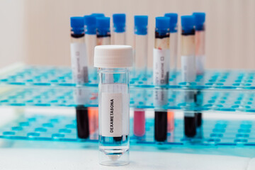 Laboratory tube with Dexamethasone inside, (covid-19 coronavirus cure), with bottom test tubes