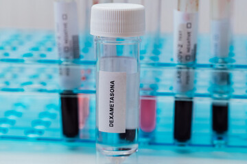 Laboratory tube with Dexamethasone inside, (covid-19 coronavirus cure), with bottom test tubes