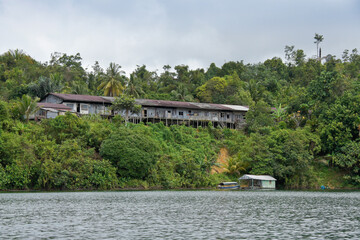 Fototapeta na wymiar Iban longhouse on hill above Batang Ai reservoir, Batang Ai National Park, Sarawak (Borneo), Malaysia