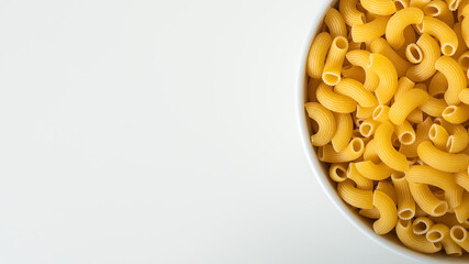 Raw dry uncooked Elbow Macaroni pasta spaghetti on white background. Good for basil tomato pesto sauce Homemade fresh Italian food organic whole wheat vegan spaghetti noodle for a healthy meal