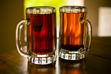tea lovers' dream: black tea in glass bear mugs (isolated) 