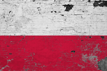 Poland flag on grunge scratched concrete surface. National vintage background. Retro wall concept.