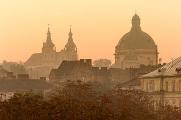 Lviv city roofs and Dominican Cathedral silhouette at sunrise, Ukraine