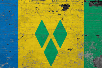 Saint Vincent And The Grenadines flag on grunge scratched concrete surface. National vintage...