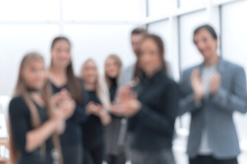 Obraz premium close up. group of happy employees applauding together