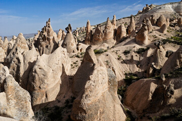 Fototapeta na wymiar Erosion-sculpted tuff formations in Devrent Valley (Imagination Valley, Pink Valley), Cappadocia, Turkey
