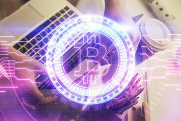 Double exposure of woman hands typing on computer and crypto market theme hologram drawing. Blockchain concept.