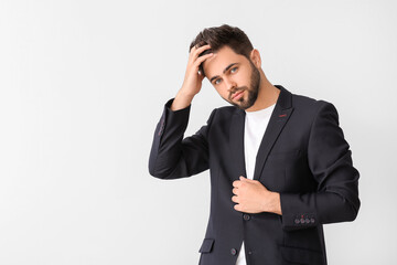 Handsome man with stylish hairdo on white background