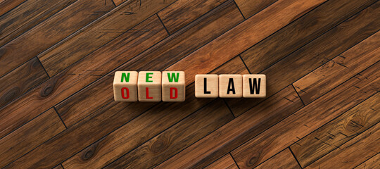 cubes with words OLD LAW and NEW LAW on wooden background