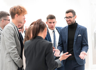 group of employees enthusiastically discussing new ideas.