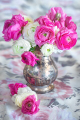Close-up floral composition with a pink Ranunculus flowers . Beautiful bouquet of a spring flowers.
