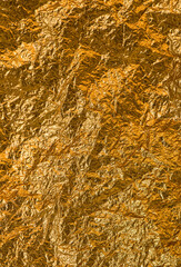 Crumpled Shiny yellow leaf of gold foil texture mapping background