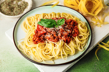 Plate with tasty pasta bolognese on table