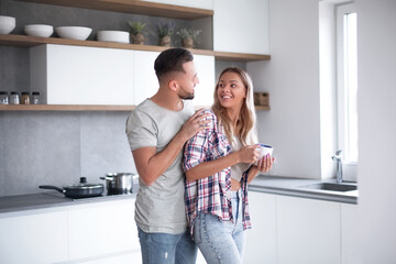 young couple in the kitchen in good morning