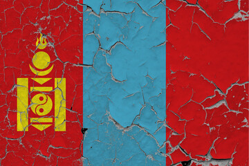 Mongolia flag close up grungy, damaged and scratched on wall peeling off paint to see inside surface. Vintage National Concept.