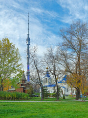 Obraz premium Autumn city landscape. Olginsky church in Ostankino on the background of the Ostankino tower. Moscow, Russia.