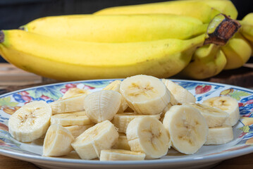 Bananas. Arrangement with sliced ​​bananas on plate