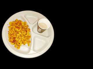 Cooked Macaroni with elbow pasta an cheese with tea and tomato sauce indian breakfast