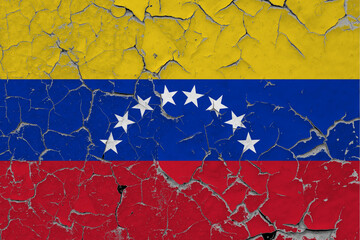 Venezuela flag close up grungy, damaged and scratched on wall peeling off paint to see inside surface. Vintage National Concept.