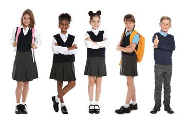 Children in school uniforms on white background