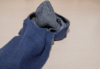 Gray knit cap and blue scarf