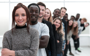 close-up . young woman standing in front of a group of young people