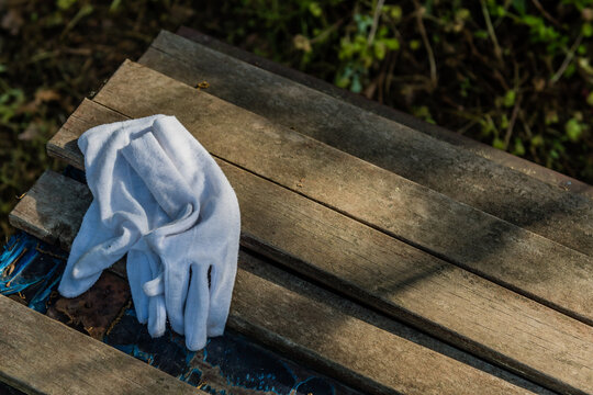 Pair of white cloth gloves