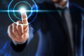Man pressing button on virtual screen, closeup