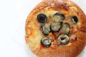Black olive and cheese bread on white dish for breakfast