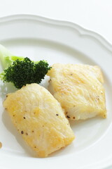 homemade black pepper cod fish fillet served with broccoli