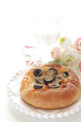 Black olive and cheese bread on white dish for breakfast