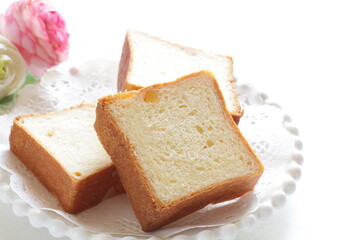 Sliced orange bread on wooden board with copy space