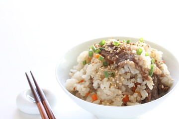 Japanese food, beff and carrot mixed rice with sesame and spring onion