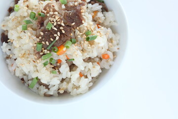 Japanese food, beff and carrot mixed rice with sesame and spring onion