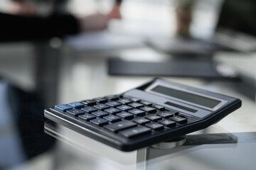 Black digital calculator in officce. on the table