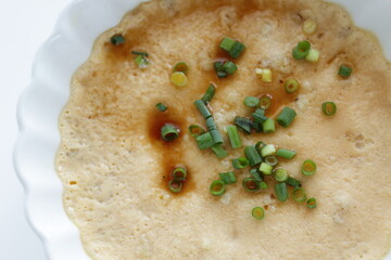 Chinese food, steamed mince pork and egg with soy sauce 