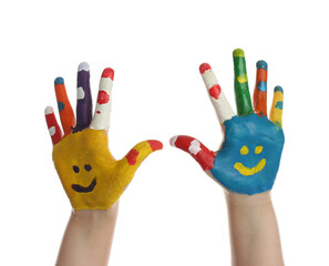 Fototapeta premium Kid with smiling faces drawn on palms against white background, closeup