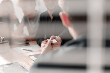 Group Of Designers Meeting Around Table In Modern Office