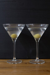 Martini glasses and on wooden table
