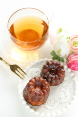 French confectionery, Canele sweet dessert on dish with copy space