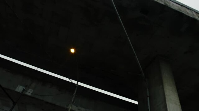 MONTREAL CANADA - March 12 2018 Worms eye rotating shot traveling under the turcot interchange highway bridge. Old and aging cement infrastructure.