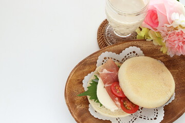 Homemade ham and Mozzarella cheese with herbal oba in English Muffin sandwich