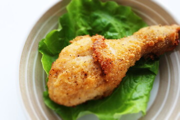 fried chicken on lettuce with copy space