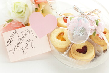 Homemade heart shaped jam cookies and valentine day card