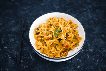 plant-based food, vegan garlic tahini sauce pasta with mediterranean vegetables