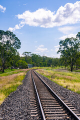 Fototapeta na wymiar Rail tracks in Queensland countryside during summer