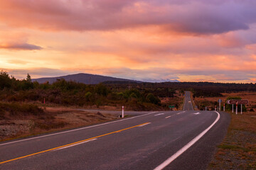 Fototapeta na wymiar Picturesque sunrise over State Highway, Te Anau, New Zealand
