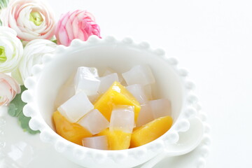 canned peach and Nata de coco in bowl for healthy dessert