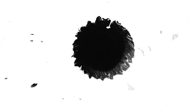 Black ink drop dripping and spreading on white paper, ink motion effect, liquid